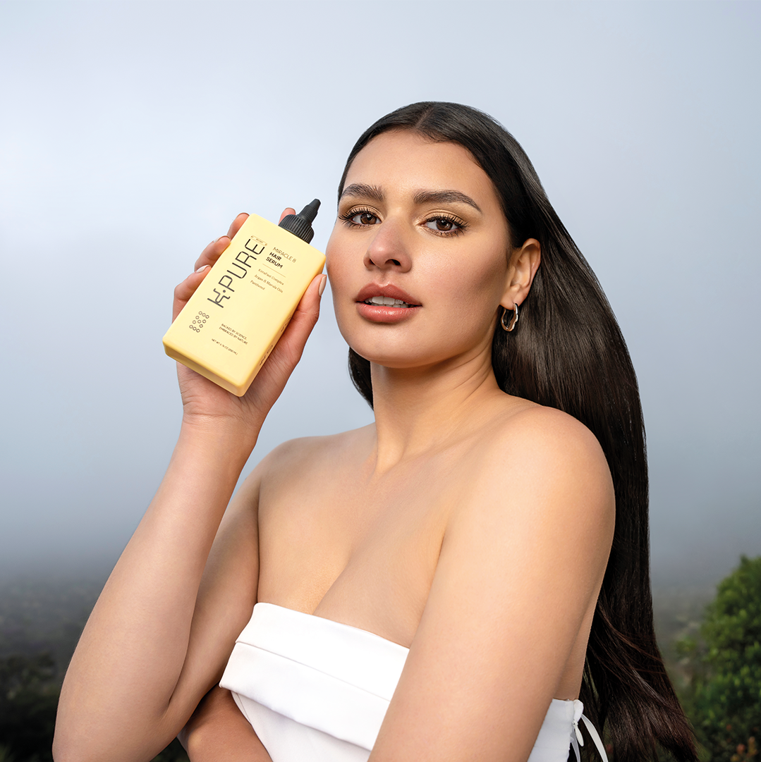 Kpure model promoting miracle 8 hair serum for hydrated and strong hair