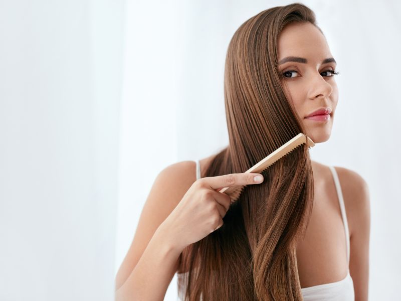 A woman combing her hair