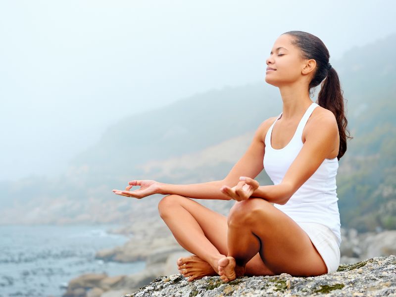 A woman doing a yoga in early in the morning