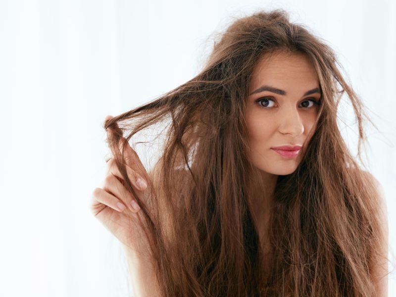 A woman with brittle and damaged hair