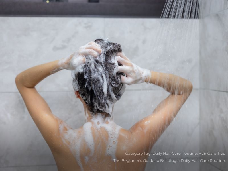 Woman washing her hair with shampoo in shower